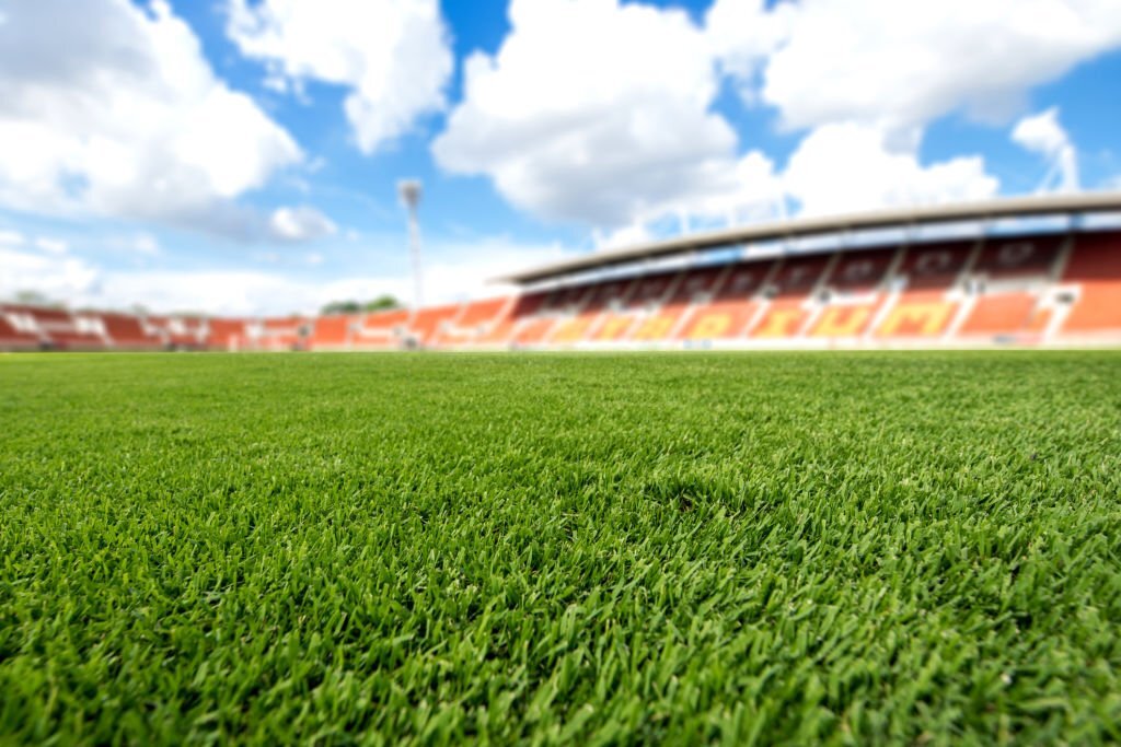 advantages of artificial grass for a football field