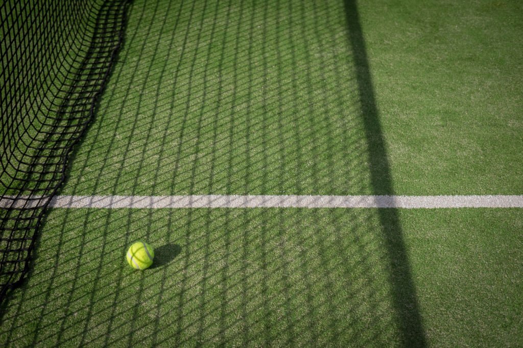 process of building an artificial grass tennis court